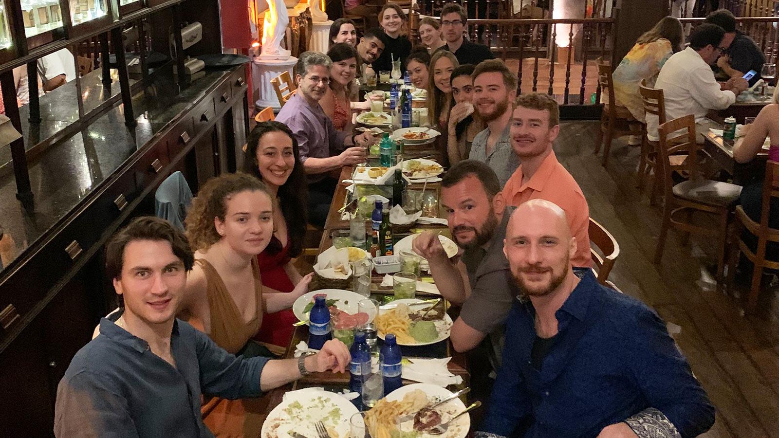 Group of Elisabeth Haub School of Law students out to dinner in a restaurant
